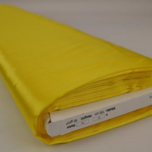 Gele satijn stof op rol