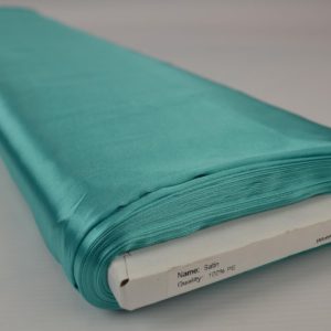 Turquoise satijn stof op rol
